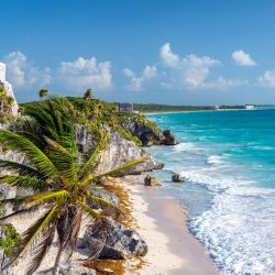 Ruins,Of,Tulum,,Mexico,And,A,Palm,Tree,Overlooking,The